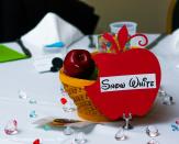 <div class="caption-credit"> Photo by: Shari Photography</div>The guest tables were outfitted in different Disney-themes. The Snow White table included a poisonous apple centerpiece.