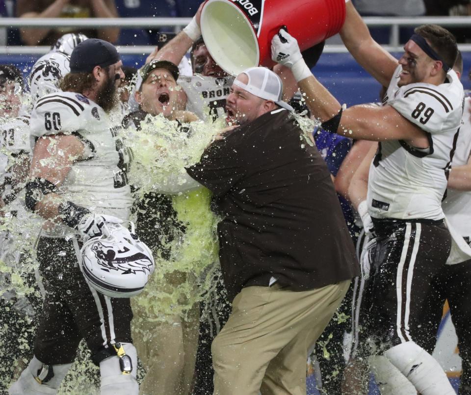 Western Michigan head coach Tim Lester gets a Gatorade shower after the Broncos&#39; 52-24 win over the Nevada Wolf Pack in the Quick Lane Bowl on Monday, Dec. 27, 2021, at Ford Field.