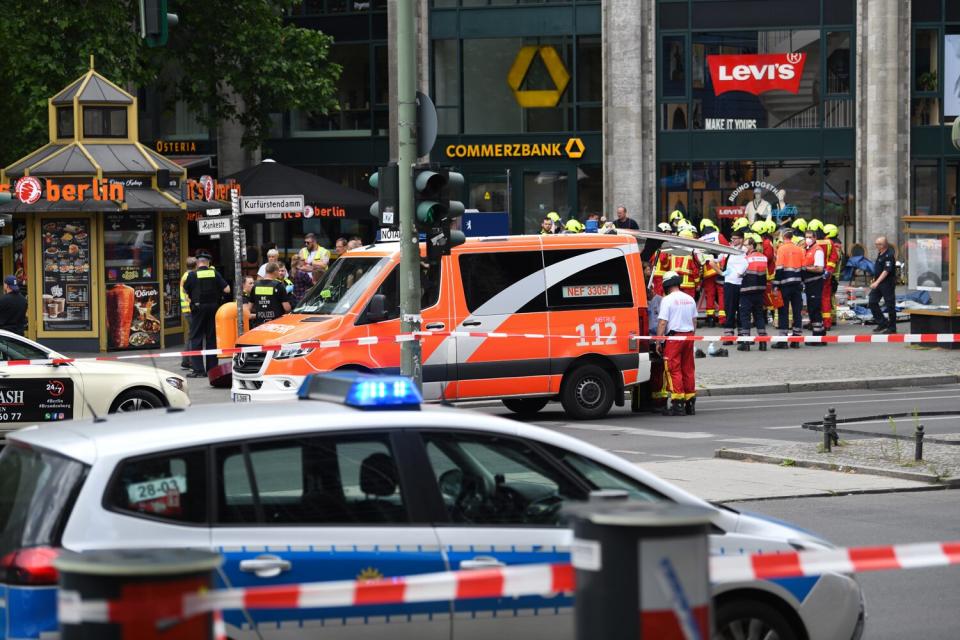 Police and emergency services secure the area after an incident. A car drove into a group of people near the Memorial Church in Berlin