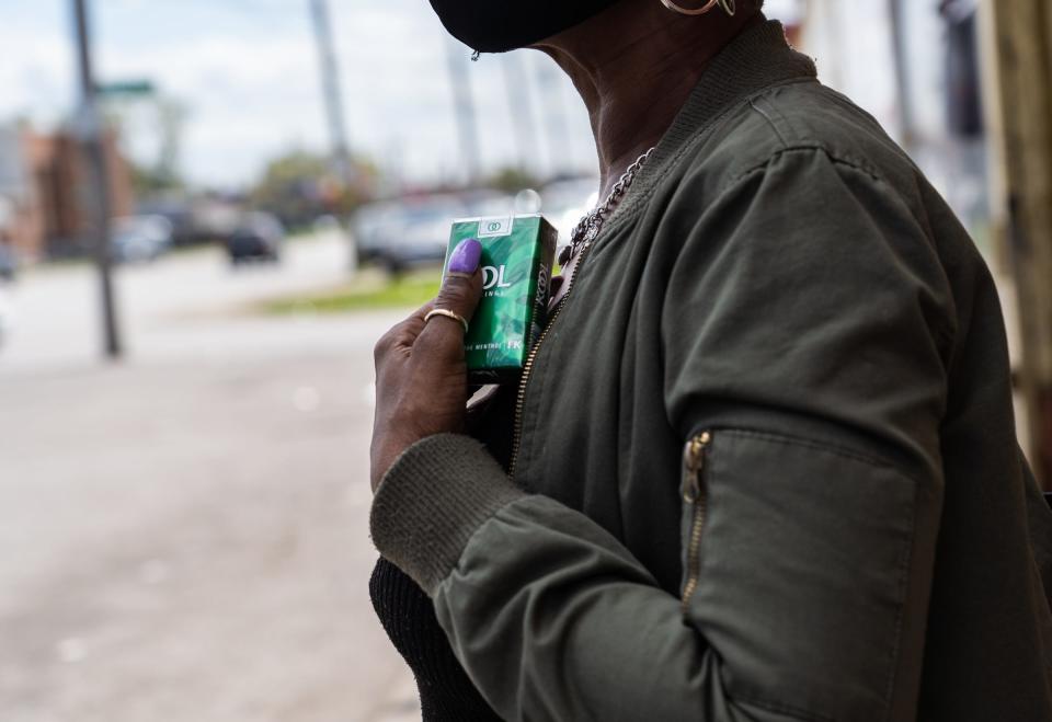 Sheila Powe of Detroit talks about the nationwide ban of menthol cigarettes aimed at protecting African Americans outside of Big V Party Store on Greenfield Road in Detroit on April 30, 2021.