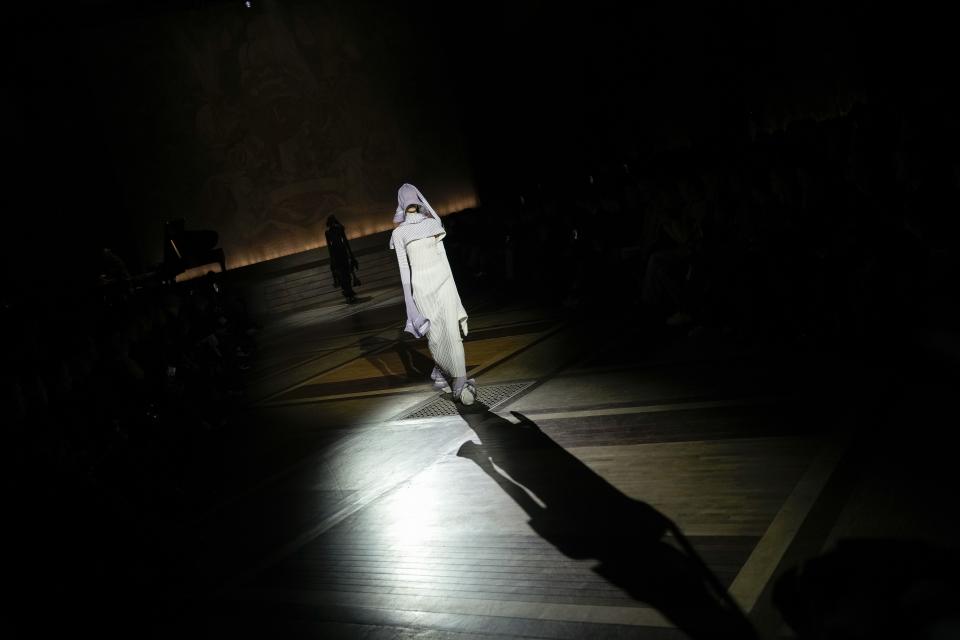 A model wears a creation as part of the Issey Miyake Fall/Winter 2024-2025 ready-to-wear collection presented Friday, March 1, 2024 in Paris. (Photo by Scott A Garfitt/Invision/AP)