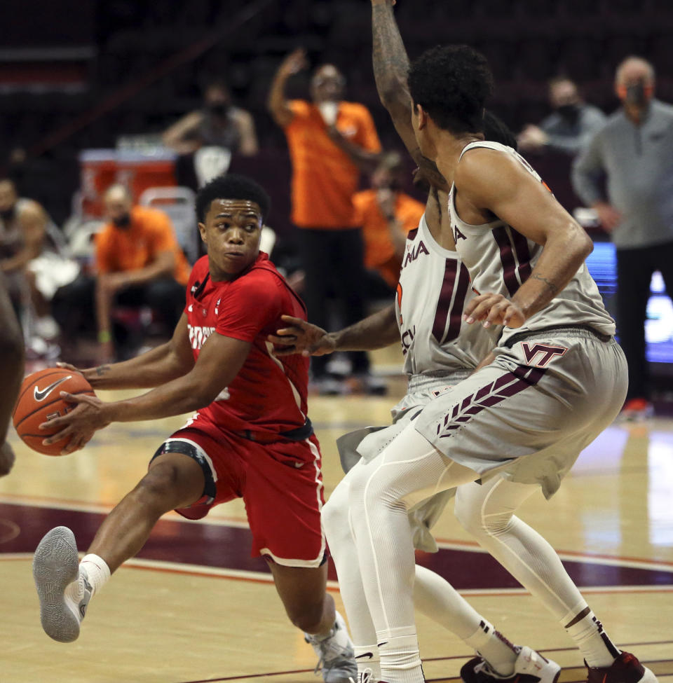 Radford's Fah'Mir Ali (0) looks to pass during the the second half of an NCAA college basketball game against Virginia Tech, Wednesday Nov. 25, 2020, in Blacksburg Va. (Matt Gentry/The Roanoke Times via AP)