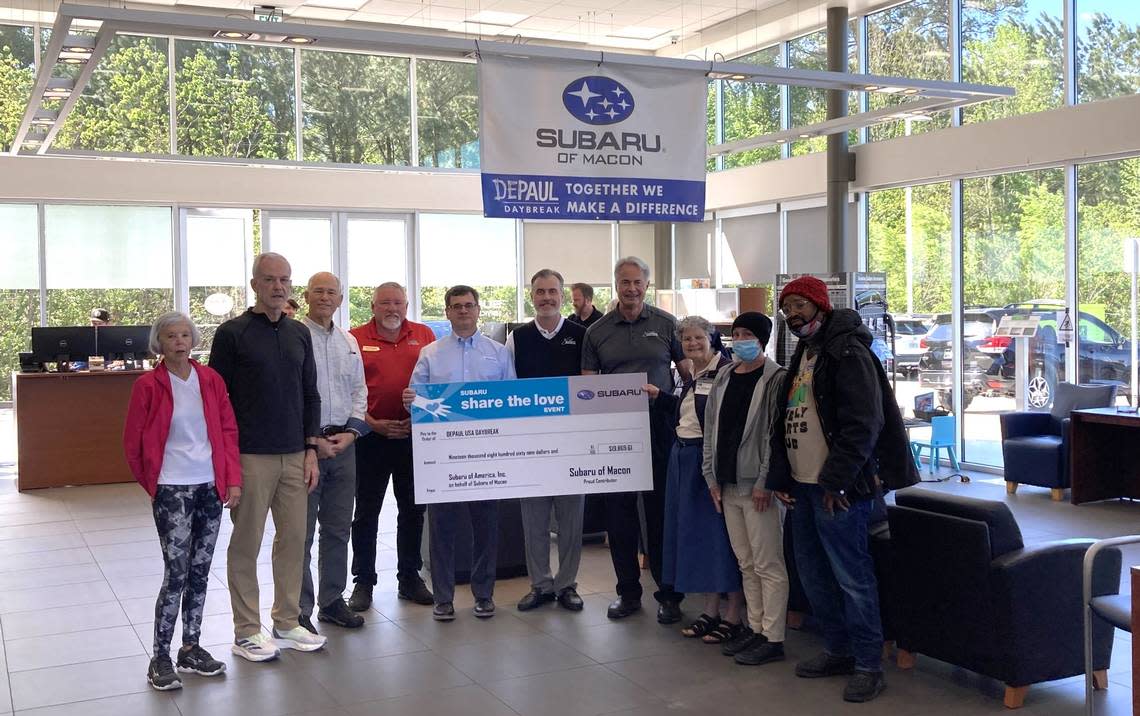 Representatives from Subaru of Macon and Daybreak Day Resource Center smile for a photo during a check presentation on Friday. Subaru raised more than $19,000 for the nonprofit through its Share the Love campaign.