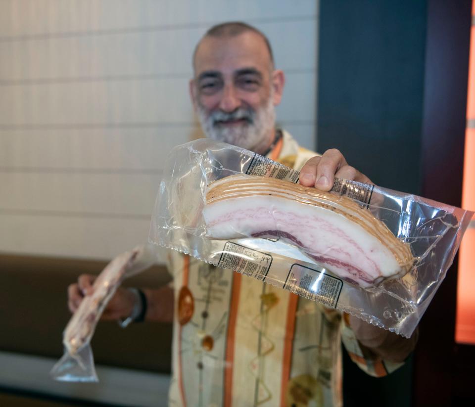 Jonny Mascia, the owner of the new BarSteak restaurant, shows off cuts of French bacon he plans to use at his new downtown Pensacola for selected menu items on Thursday, Sept. 7, 2023. 
.
