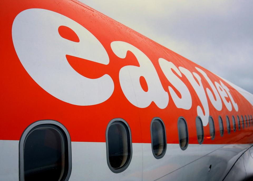 Passengers board an EasyJet flight. Now about nine million people have had their travel details compromised: PA