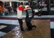 Afghan youth practise breakdancing during a training session in Kabul