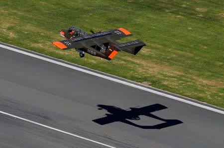 An OV-10 Bronco aircraft, decorated with World War One commemoration motifs, takes off at Flanders international airport, ahead of the world's first Short Take Off & Landing competition on sand, in Wevelgem, Belgium May 8, 2018. REUTERS/Francois Lenoir