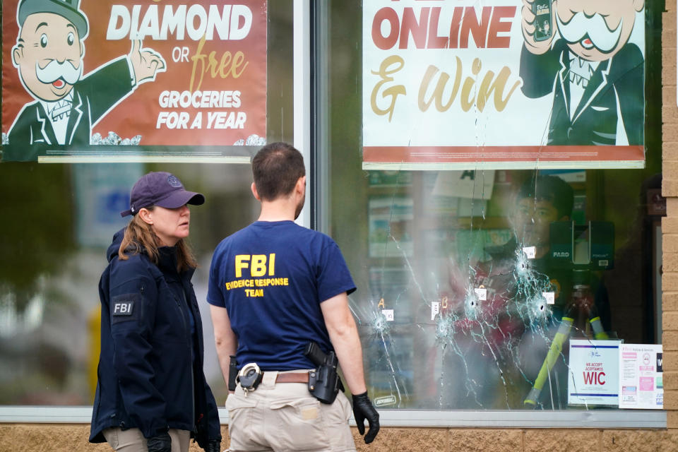 FILE - Investigators work the scene of a shooting at a supermarket, in Buffalo, N.Y., Monday, May 16, 2022. The city of Buffalo will pause Sunday to mark the passing of one year since the attack. Events include a moment of silence and the chiming of church bells. (AP Photo/Matt Rourke, File)