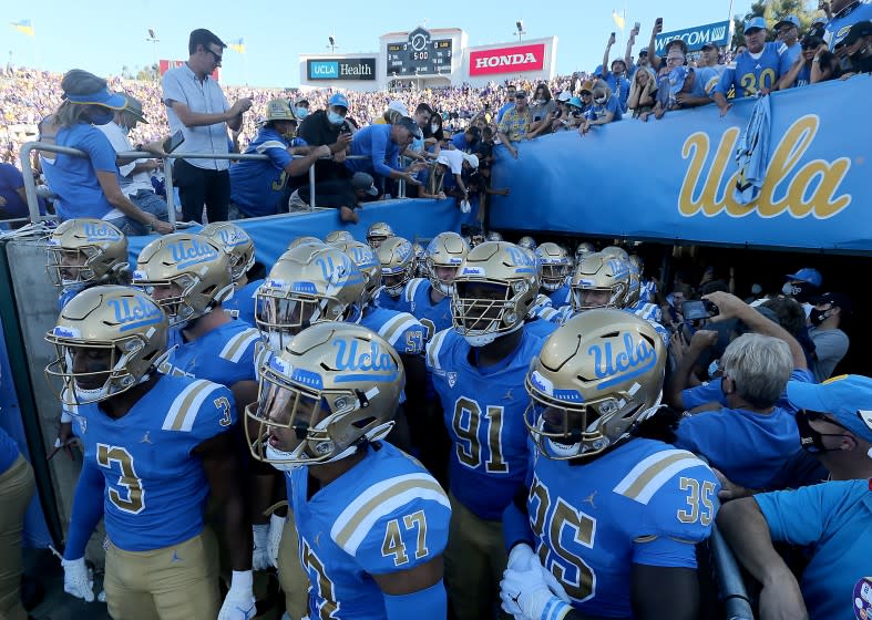 PASADENA, CALIF. - SEP. 4, 2021. The UCLA Bruins football team prepares to take the field for a game against LSU at the Rose Bowl on Saturday, Sept. 4, 2021. (Luis Sinco / Los Angeles Times)