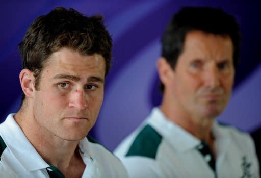 Australian Wallabies captain James Horwill (L) and coach Robbie Deans at a press conference in October 2011. Horwill damaged his hamstring during the Queensland Reds' 13-12 Super 15 win over the ACT Brumbies on Saturday