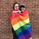 <p>Two young revelers wrap themselves in a pride flag during the New York City Gay Pride Parade on June 24, 2018. (Photo: Kayla Somen) </p>