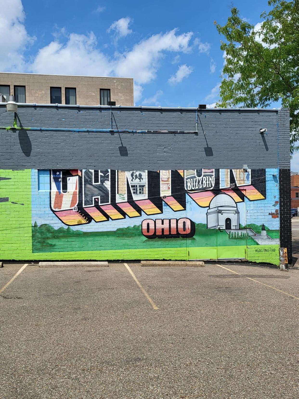 A postcard-style mural that said "Greetings from Canton, Ohio," was recently covered with gray and black paint. The mural had been located on the side of the former Buzzbin building at 331 Cleveland Avenue NW.
