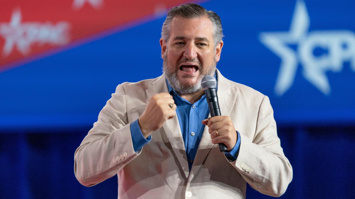 Ted Cruz holding a microphone