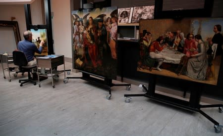 David Crombie, Senior Paintings Conservator at the National Museums, Liverpool carries out restoration work on the painting 'Am Not I A Man And A Brother', one of only 2 known paintings of its type in existence in Liverpool, Britain, July 30, 2019. Picture