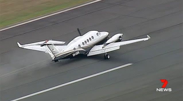 The plane skidded when it hit the runway after reports its landing gear caused problems for the aircraft. Pictures: 7 News