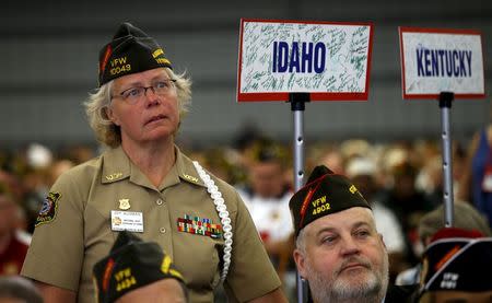 A veteran stands as she listens to President Barack Obama address the 116th National Convention of the Veterans of Foreign Wars in Pittsburgh, Pennsylvania July 21, 2015. REUTERS/Kevin Lamarque