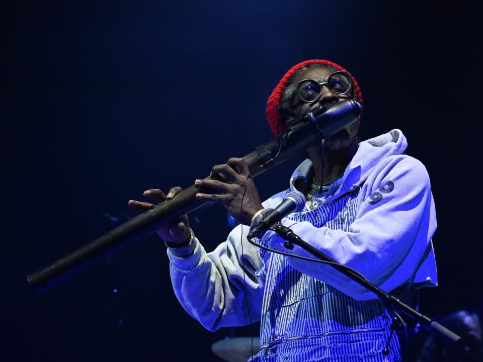 André 3000 performs on "The Late Show with Stephen Colbert" in 2024.