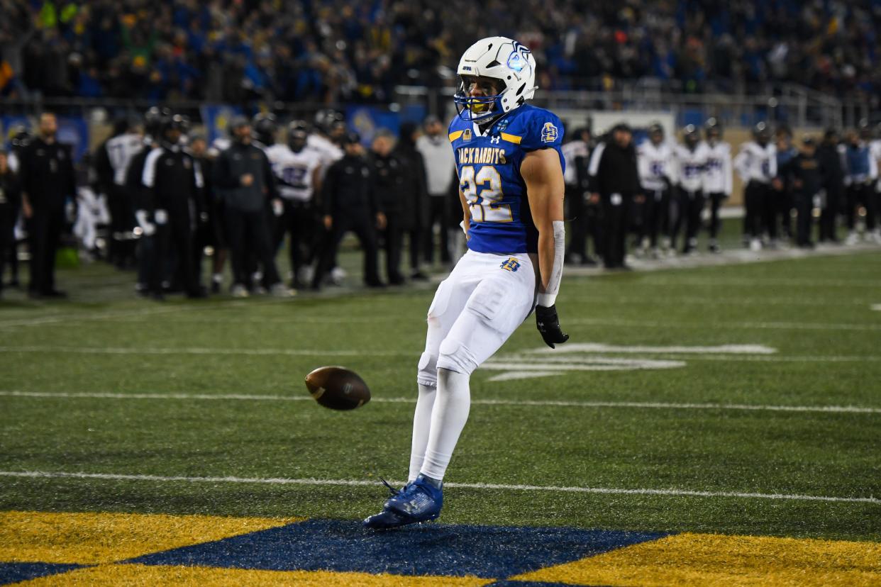 SDSU's running back Isaiah Davis (22) throws the ball on the ground after a touchdown on Friday, Dec. 15, 2023 at Dana J. Dykhouse in Brookings.