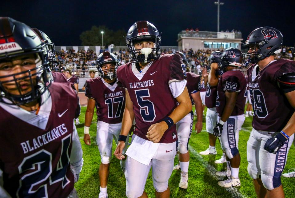 La Quinta's Sean Jones (5) turns to take the field after huddling with his offense to start the second quarter of their game in La Quinta, Calif., Thursday, Aug. 31, 2023.