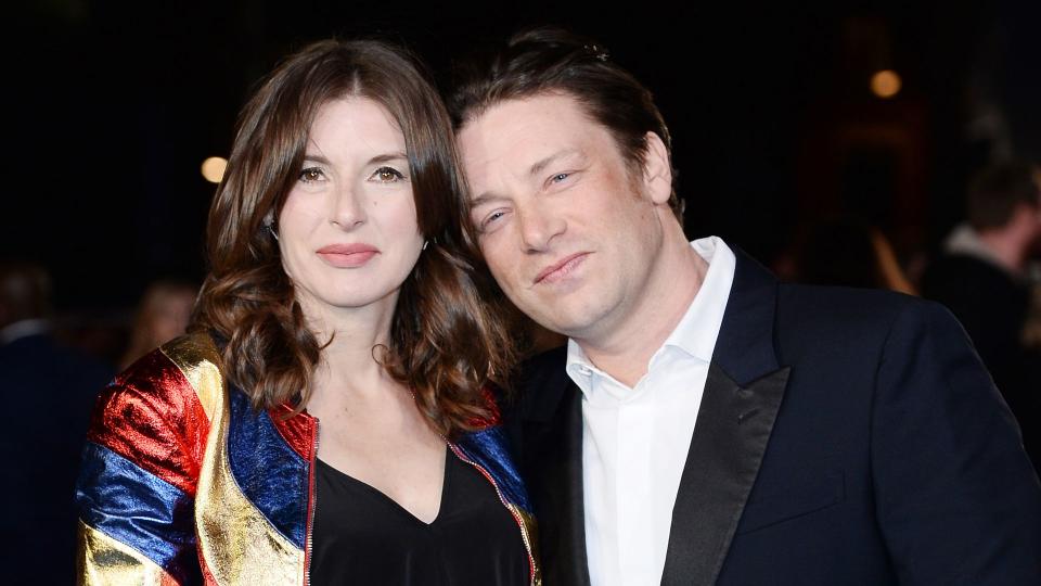 Jamie Oliver resting head on Jools Oliver's shoulder