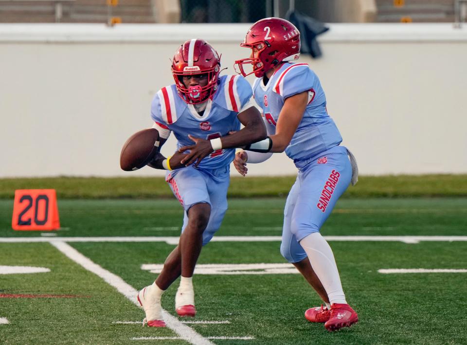 Seabreeze's Ty Cordare (4) fumbles the hand-off from Hayden Hayes during a game with University at Daytona Stadium in Daytona Beach, Friday, Sept. 8, 2023. 