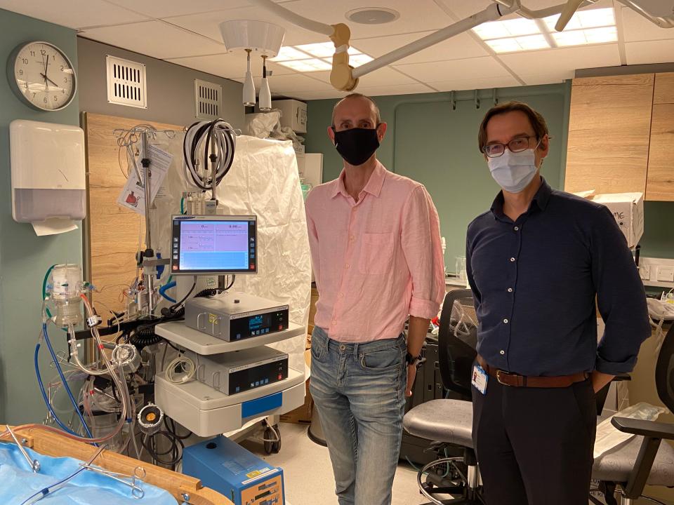 Recovery man: Paul Curtis and Dr Georg Auzinger beside an ECMO machine at King’s College hospital (King’s College hospital)