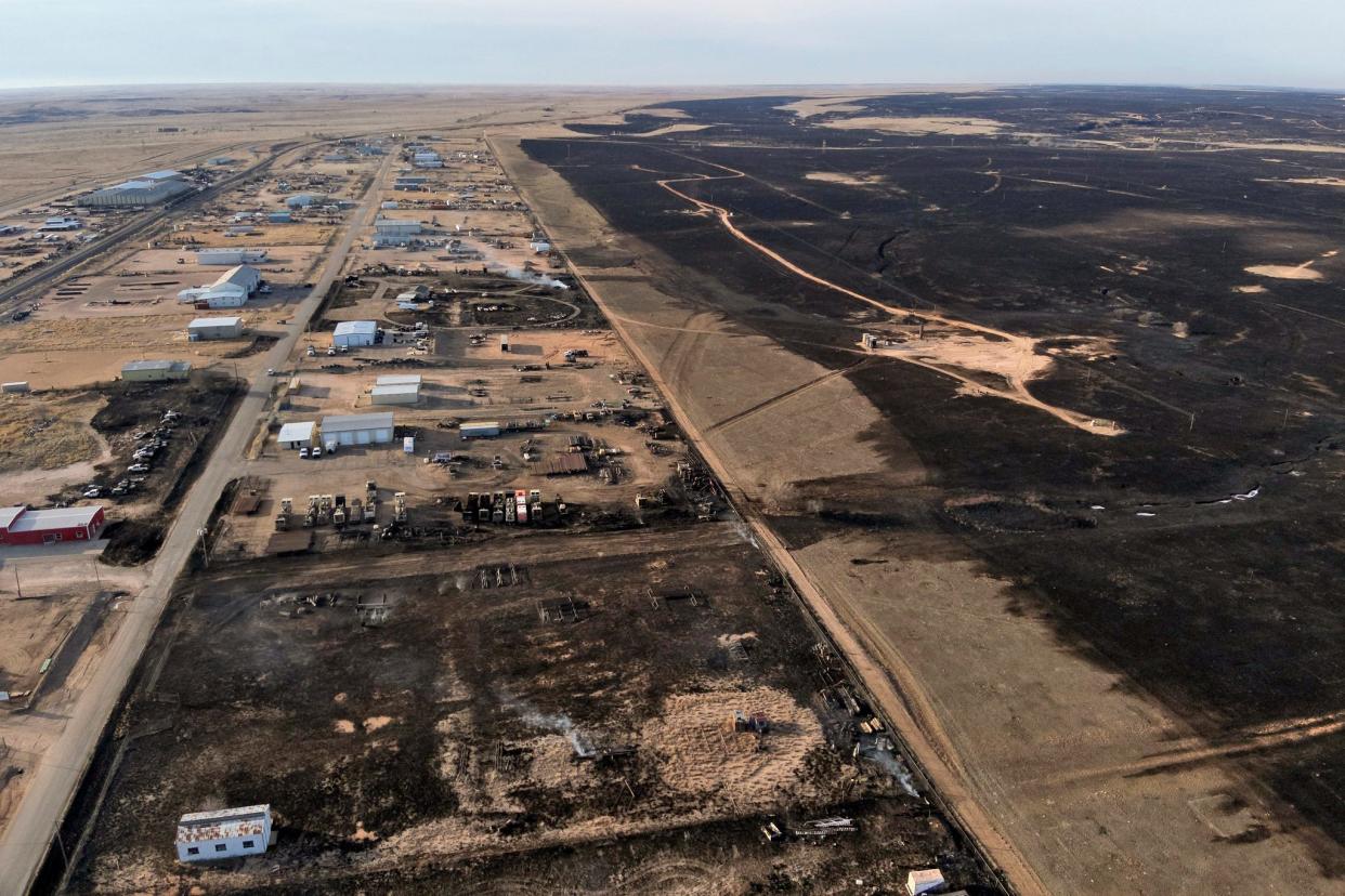 This aerial image provided by the city of Borger/Hutchinson County Office of Emergency Management on Wednesday shows property damaged from a wildfire. On the right, running up the image, part of a 7-mile burn that the region cooperated on a few months back.