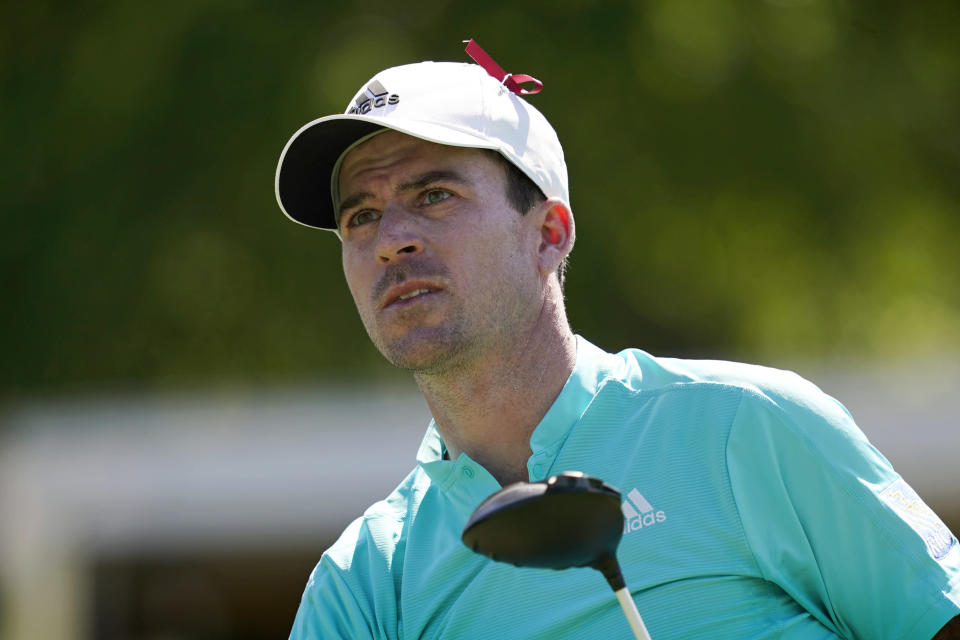 Nick Taylor, of Canada, watches his shot off the 15th tee during the first round of the Charles Schwab Challenge golf tournament at the Colonial Country Club, Thursday, May 26, 2022, in Fort Worth, Texas. (AP Photo/Tony Gutierrez)