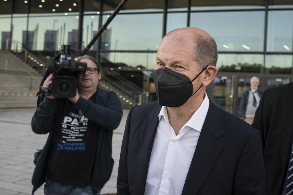 German Finance Minister Olaf Scholz and Social Democratic Party candidate for chancellor, leaves after exploratory talks with the SPD, FDP and Green party in Berlin, Thursday, Oct. 7, 2021. (AP Photo/Steffi Loos)
