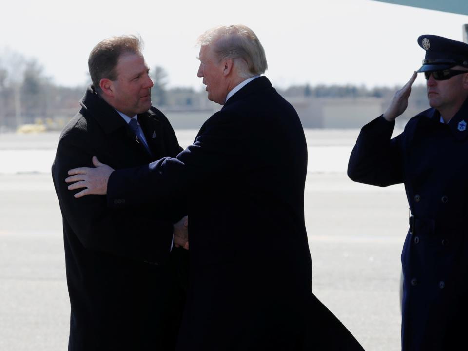 New Hampshire Governor Chris Sununu greets U.S. President Donald Trump as he arrives aboard Air Force One at Manchester-Boston Regional Airport in Manchester, New Hampshire, U.S. March 19, 2018.