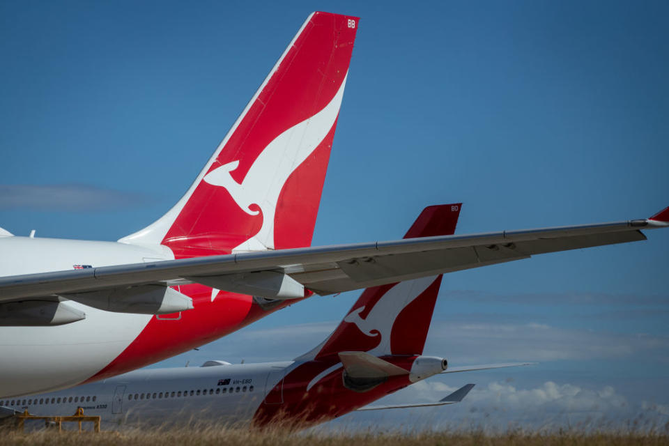 The Qantas Airways Ltd. logo is displayed on the tails of aircraft standing at Brisbane Airport in Brisbane, Australia, on Tuesday, June 9, 2020.