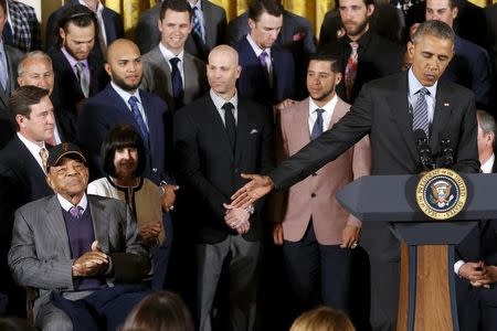 U.S. President Barack Obama (R) acknowledges Hall of Fame player Willie Mays (L) during a reception for the San Francisco Giants, Major League Baseball's 2014 World Series champions, in the East Room of the White House in Washington, June 4, 2015. REUTERS/Jonathan Ernst