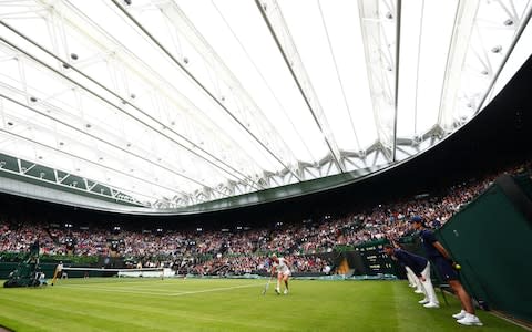 Murray was among those to play on Wimbledon's No.1 Court on Sunday to mark the unveiling of the new closing roof - Credit: Getty Images