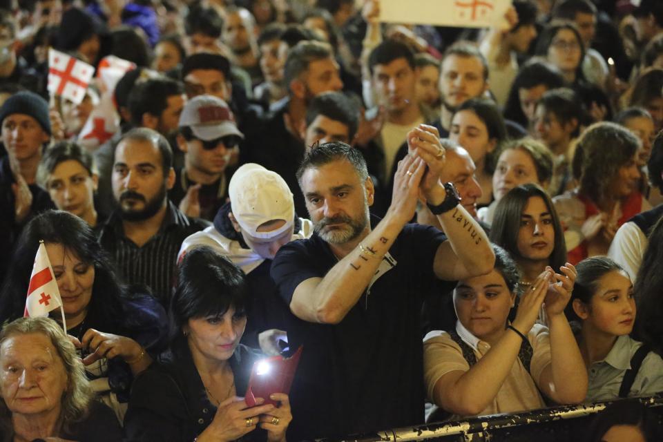 Demonstrators gather outside the parliament building in Tbilisi, Georgia, on Wednesday, April 17, 2024, to protest against "the Russian law" similar to a law that Russia uses to stigmatize independent news media and organizations seen as being at odds with the Kremlin. (AP Photo/Zurab Tsertsvadze)