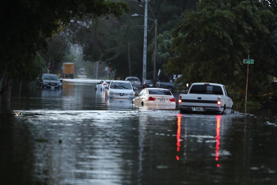 Multiple cars stalled in deep flood water after heavy overnight downpours near Northeast 119th Street and Northeast 14th Avenue in North Miami.