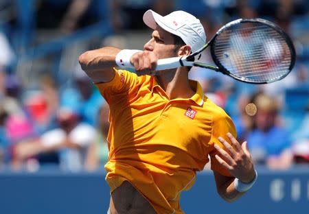 Aug 20, 2015; Cincinnati, OH, USA; Novak Djokovic (SRB) returns a shot against David Goffin (not pictured) on day six during the Western and Southern Open tennis tournament at Linder Family Tennis Center. Aaron Doster-USA TODAY Sports