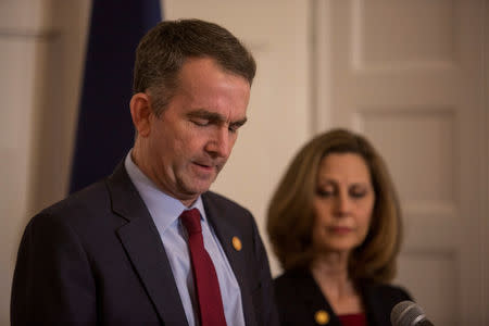 FILE PHOTO: Virginia Governor Ralph Northam, accompanied by his wife Pamela Northam announces he will not resign during a news conference in Richmond, Virginia, U.S. February 2, 2019. REUTERS/ Jay Paul/File Photo