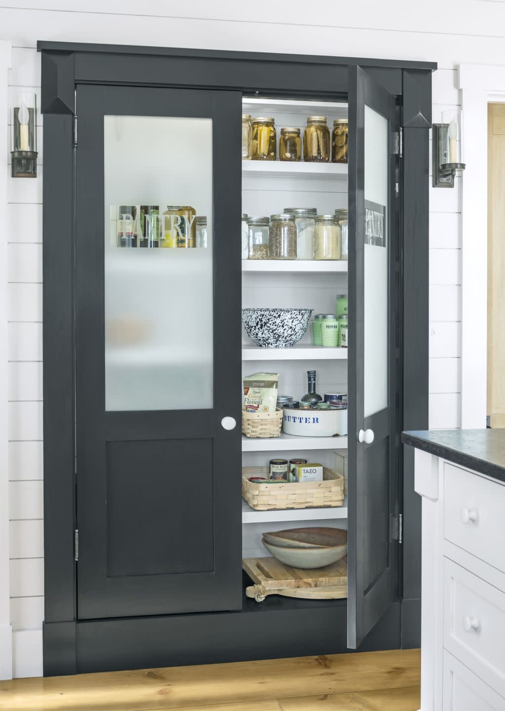 pantry with frosted glass that says pantry on it