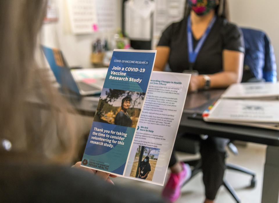 This photo provided by Johns Hopkins Center for American Indian Health shows a brochure that was used to provide information about a COVID-19 vaccine trial on the Navajo Nation, Tuesday, Dec. 29, 2020, in Chinle, Ariz. (Nina Mayer Ritchie/Johns Hopkins Center for American Indian Health via AP)