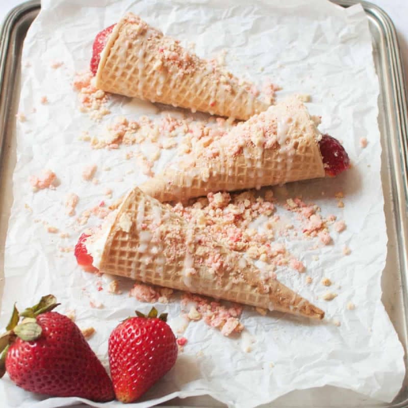 <p>Two Pink Peonies</p><p>They’re a cheesecake and strawberry-filled cone, glazed, and topped with a strawberry crunch crumble.</p><p><strong>Get the recipe: </strong><a href="https://www.twopinkpeonies.com/strawberry-crunch-cheesecake-cones/" rel="nofollow noopener" target="_blank" data-ylk="slk:Strawberry Crunch Cheesecake Cones;elm:context_link;itc:0;sec:content-canvas" class="link rapid-noclick-resp"><strong>Strawberry Crunch Cheesecake Cones</strong></a></p>
