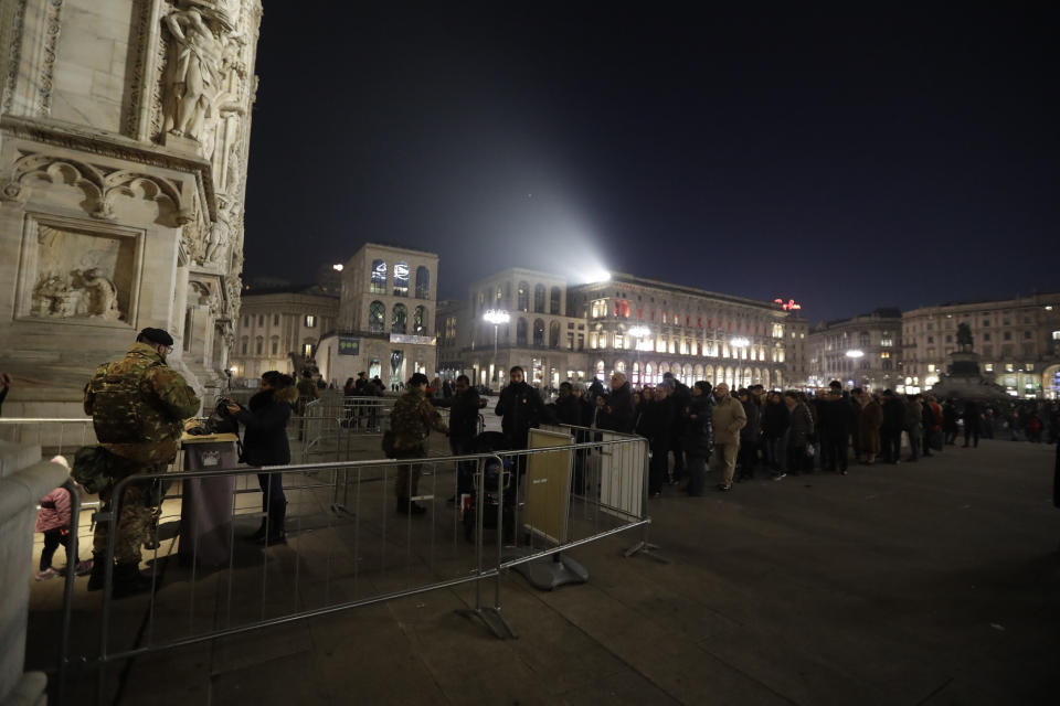 Tourists line up for security checks performed by Italian to enter the Duomo gothic cathedral in Milan, Italy, Wednesday, Dec. 23, 2016. The Tunisian man suspected of driving a truck into a crowded Christmas market in Berlin was killed early Friday in a shootout with police in Milan, ending a Europe-wide manhunt, Italy’s interior minister said. (AP Photo/Luca Bruno)