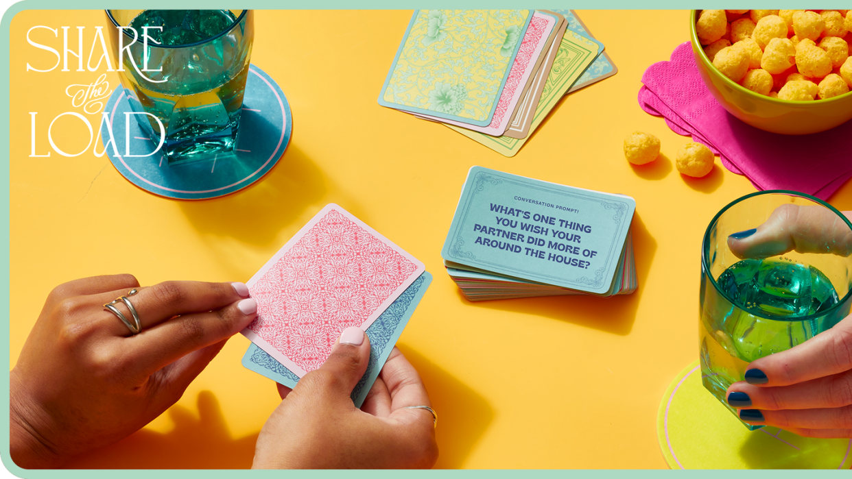 same sex couple playing with a deck of conversation cards