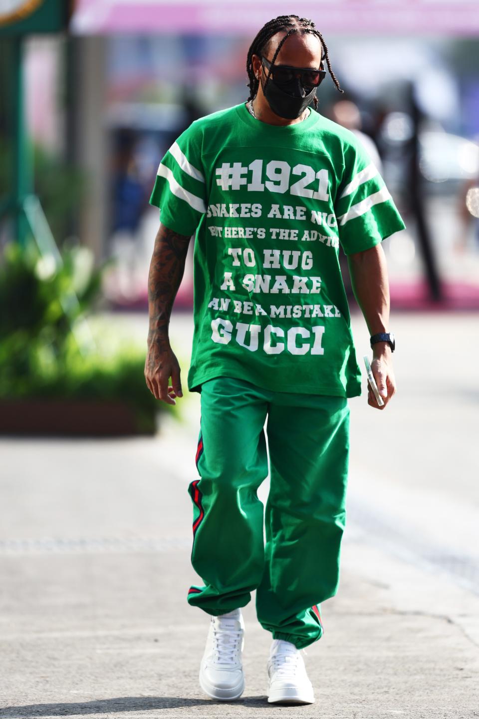 Lewis Hamilton walks in the Paddock (Getty)