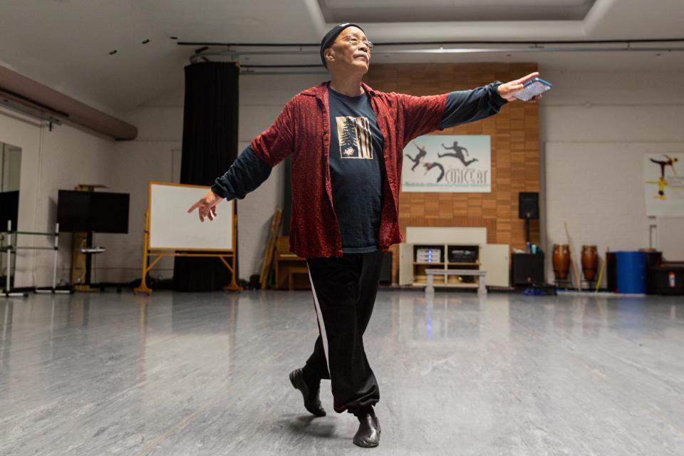 Les Watanabe warms up without ballet barres before teaching his Western Oregon University students on January 25.