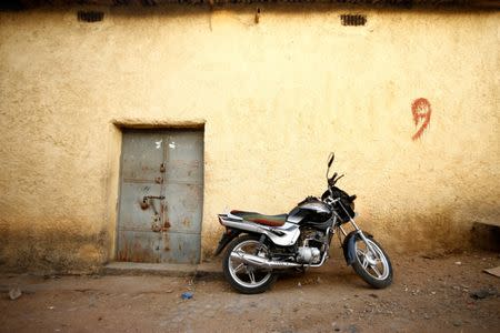 A motorbike is parked in front of a shop within the walled city of Harar, Ethiopia, February 24, 2017. REUTERS/Tiksa Negeri