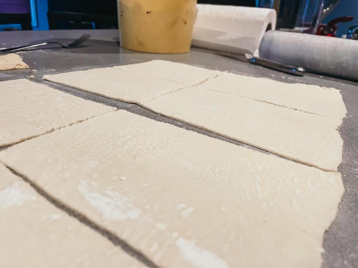 small squares of puff pastry on a counter