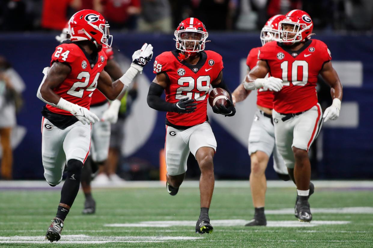 Georgia defensive back Christopher Smith (29) returns a blocked field goal for a touchdown during the first half of the SEC Championship NCAA college football game between LSU and Georgia in Atlanta, on Saturday, Dec. 3, 2022.