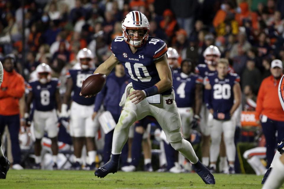 Auburn quarterback Bo Nix carries the ball against Mississippi.