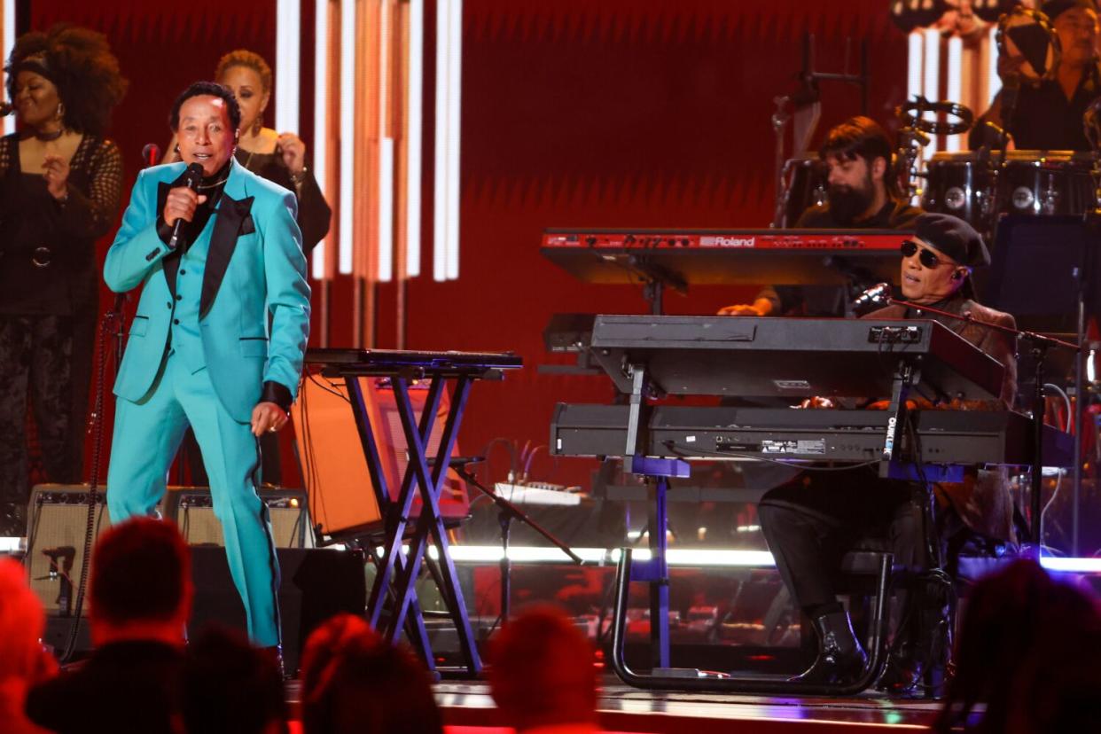 Smokey Robinson, left, and Stevie Wonder perform at the 65th Grammy Awards.