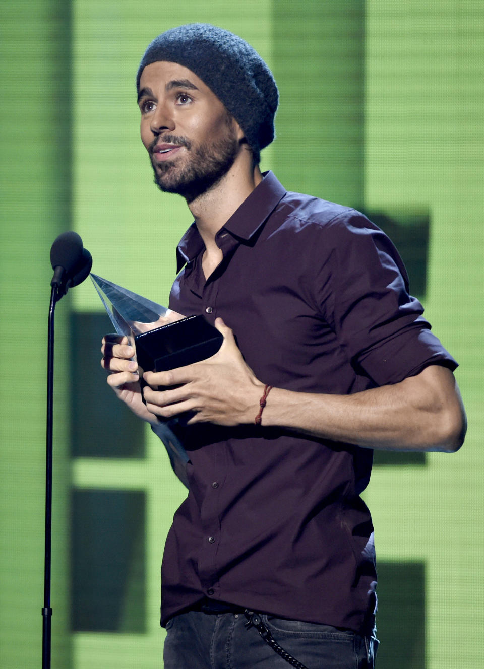 FILE - Enrique Iglesias accepts the artist of the year award at the Latin American Music Awards on Oct. 26, 2017, in Los Angeles. Iglesias turns 46 on May 8. (Photo by Chris Pizzello/Invision/AP, File)